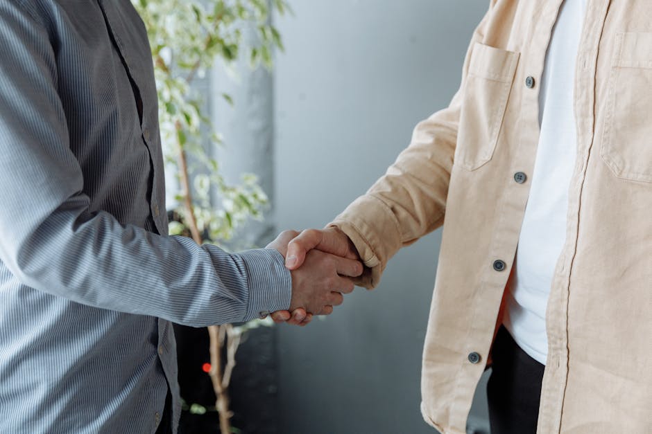 Business handshake deal—structuring property and business investments
